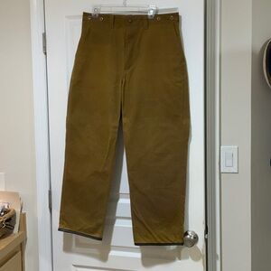 Filson Men's Tan Oil Tin Pants with leather cuffs